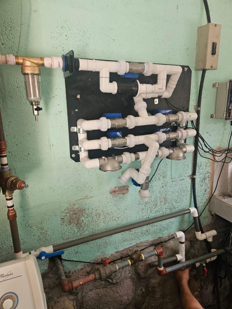 Installed water filtration and plumbing system supporting clean water efforts in Ecuador.