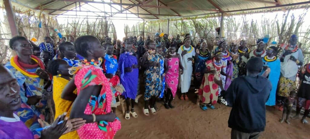 Women in Kenya gather under a shelter during a Samaritan’s Global Outreach community visit